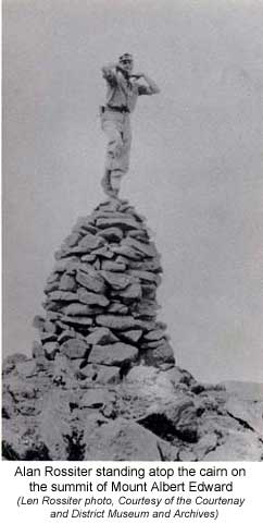 Alan Rossiter standing atop the cairn on the summit of Mount Albert Edward